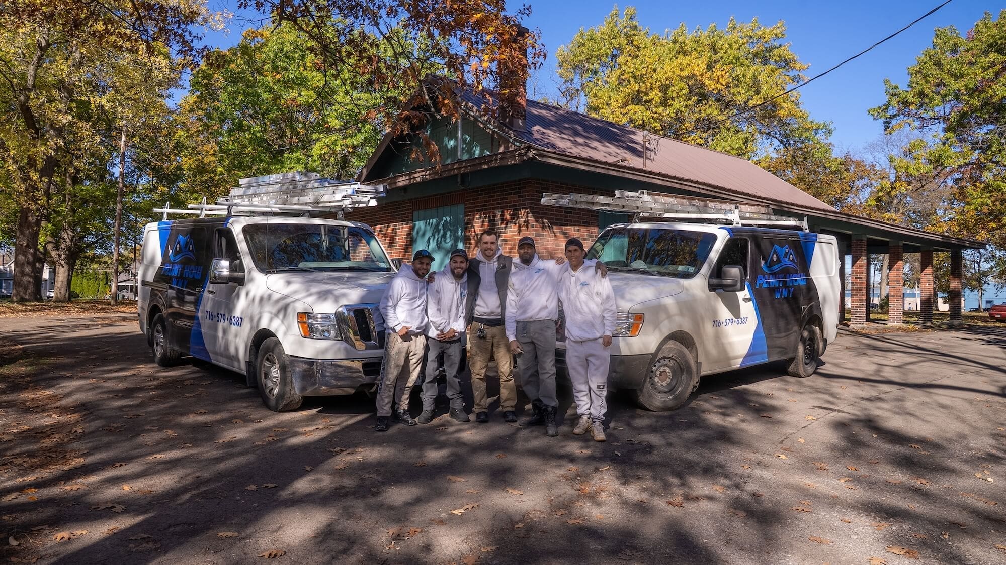 paint-now-wny-team- the paint now wny teamin front of their branded vans